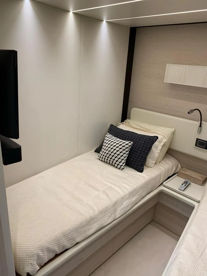 a bed with pillows aboard AMALFI Yacht for Sale
