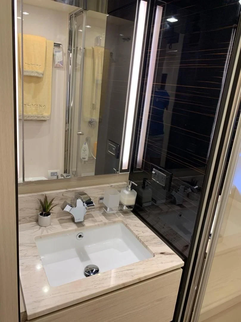 a bathroom with a large mirror aboard AMALFI Yacht for Sale