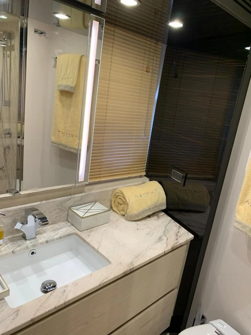 a bathroom with a sink and a mirror aboard AMALFI Yacht for Sale