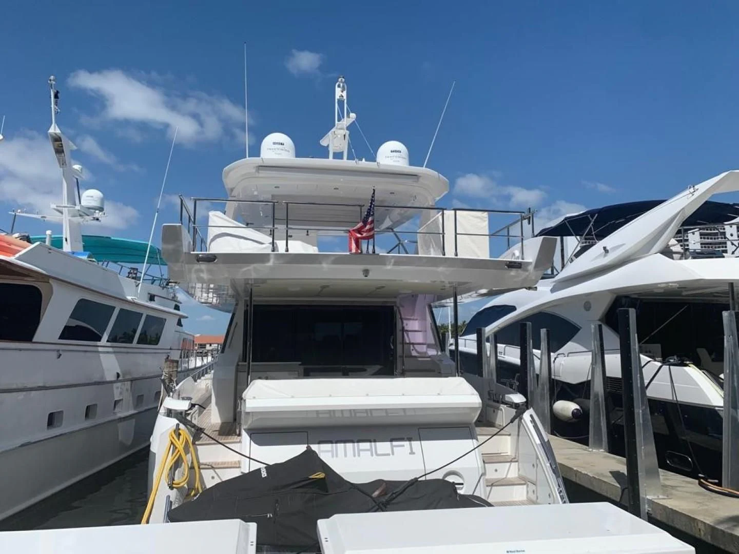 a boat docked at a pier aboard AMALFI Yacht for Sale