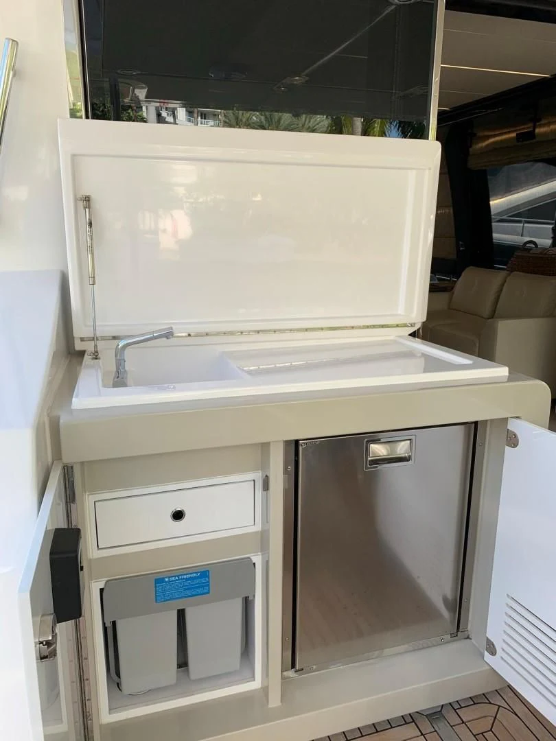 a white refrigerator with drawers aboard AMALFI Yacht for Sale