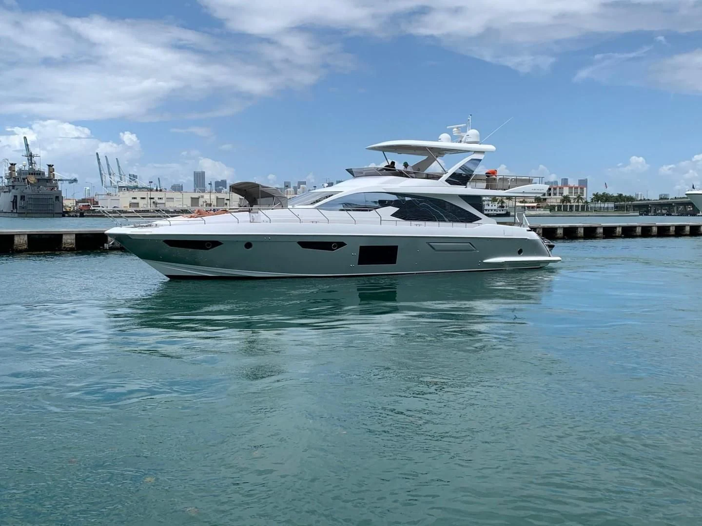 a white yacht in the water aboard AMALFI Yacht for Sale