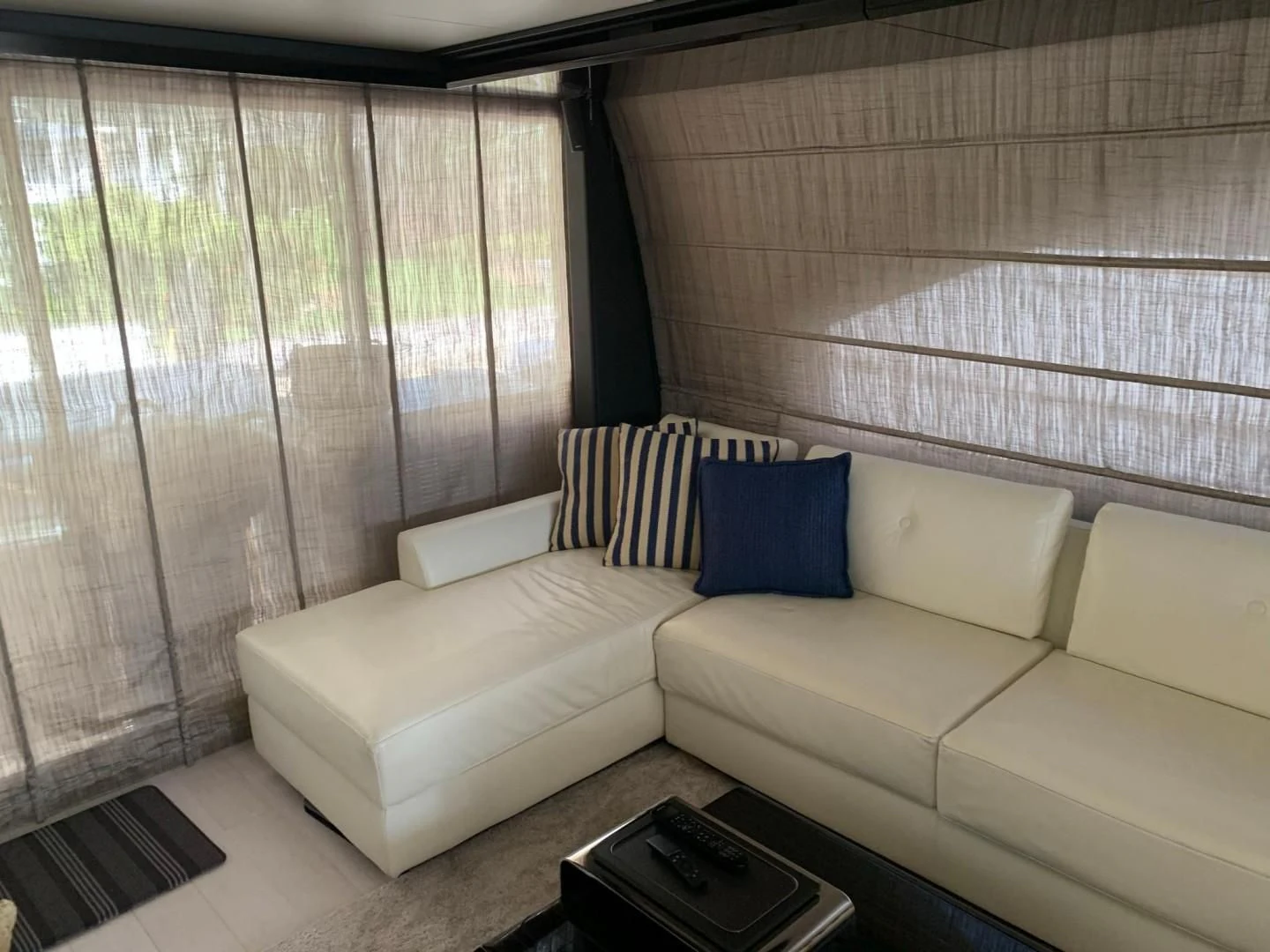 a couch and a table in a room aboard AMALFI Yacht for Sale