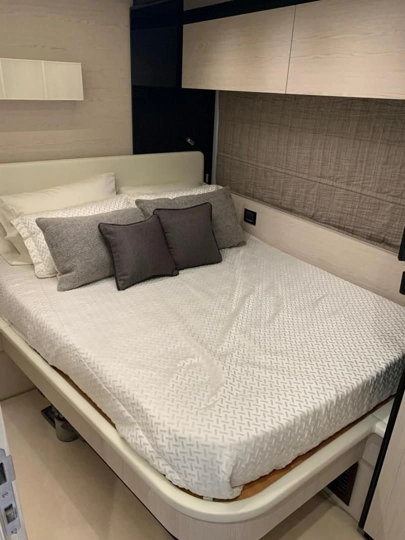 a bed with pillows aboard AMALFI Yacht for Sale