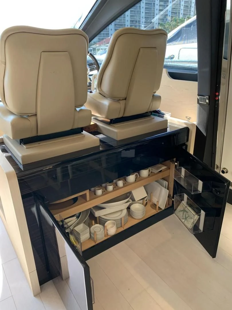a chair and a table in a room aboard AMALFI Yacht for Sale
