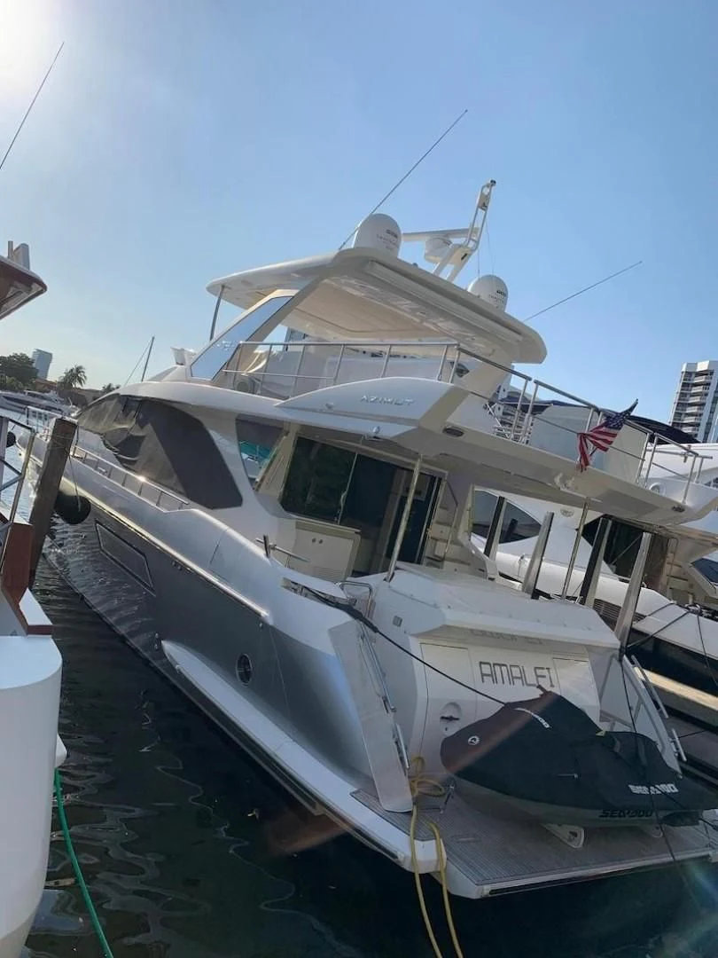 a boat docked in a harbor aboard AMALFI Yacht for Sale