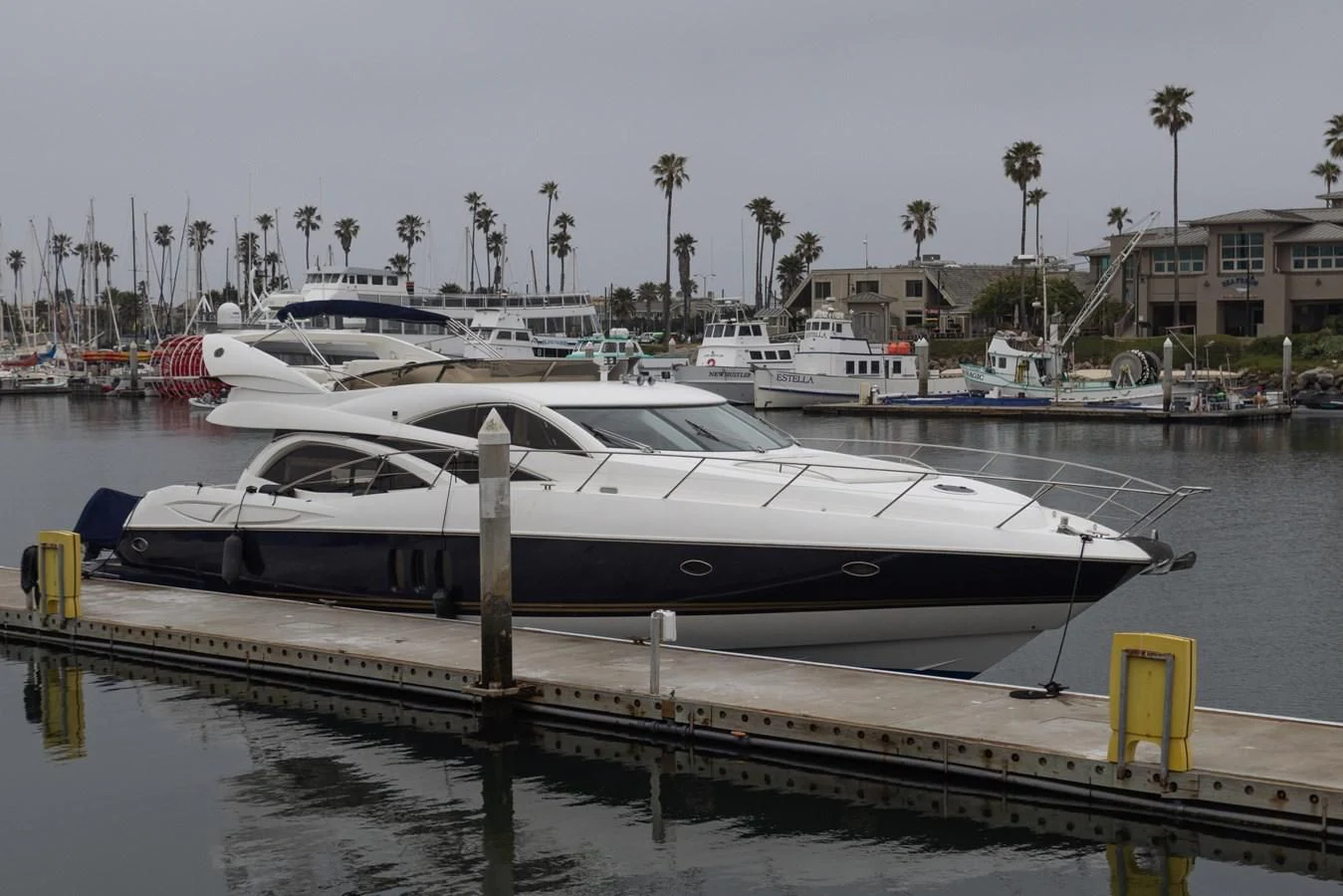 a boat docked at a pier aboard BIG DREAM Yacht for Sale