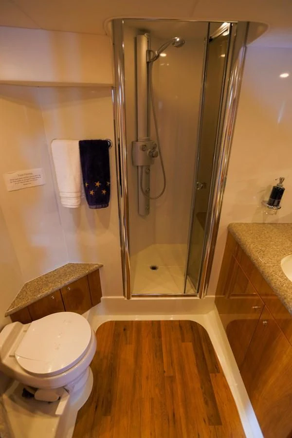 a bathroom with a glass shower aboard BIG DREAM Yacht for Sale