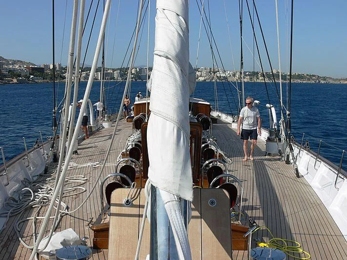 a boat with ropes and people on it aboard METEOR Yacht for Sale