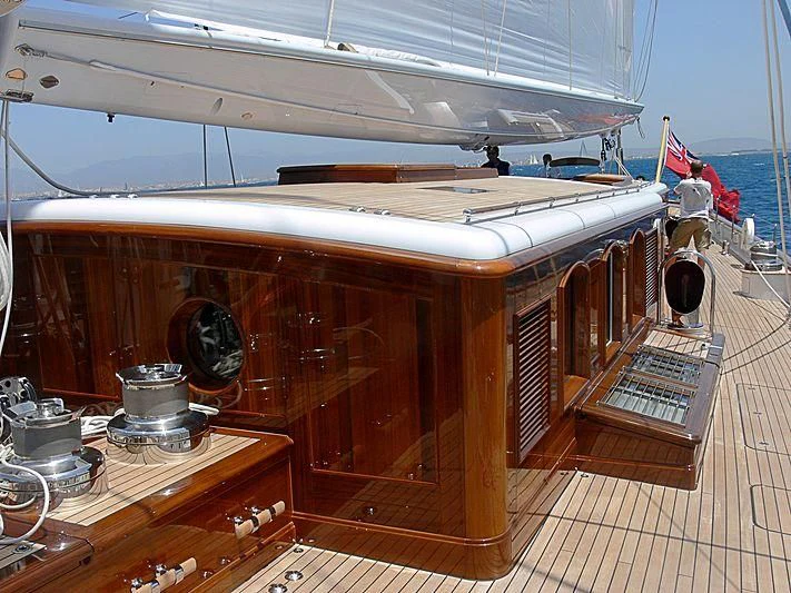a wooden boat on a deck aboard METEOR Yacht for Sale