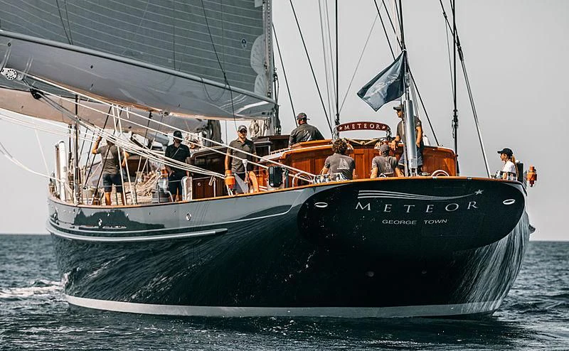 a group of people on a boat aboard METEOR Yacht for Sale