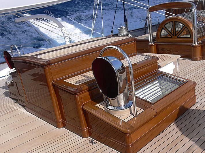 a wooden boat on a deck aboard METEOR Yacht for Sale