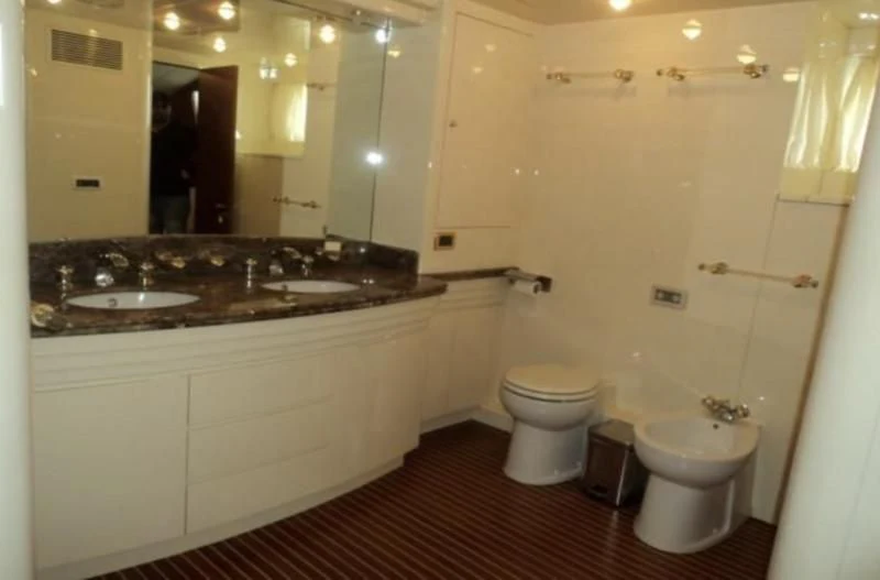 a bathroom with a sink and a toilet aboard ELMAR Yacht for Sale