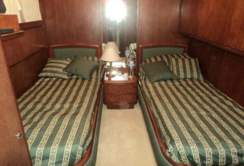 a couple of beds in a room aboard ELMAR Yacht for Sale