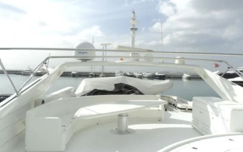 a large white boat in a large body of water aboard ELMAR Yacht for Sale