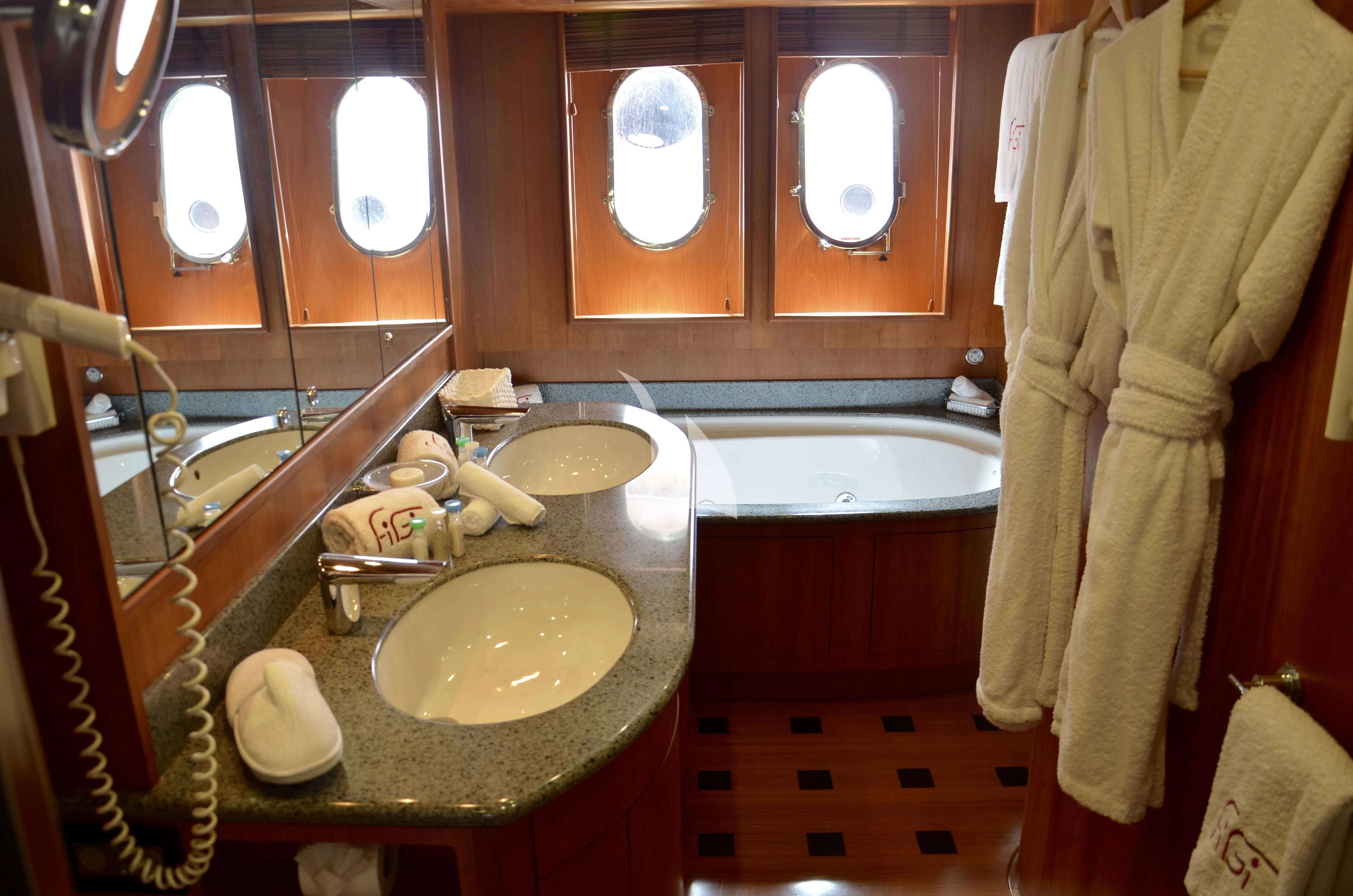 a bathroom with a sink and bathtub aboard FIGI Yacht for Sale