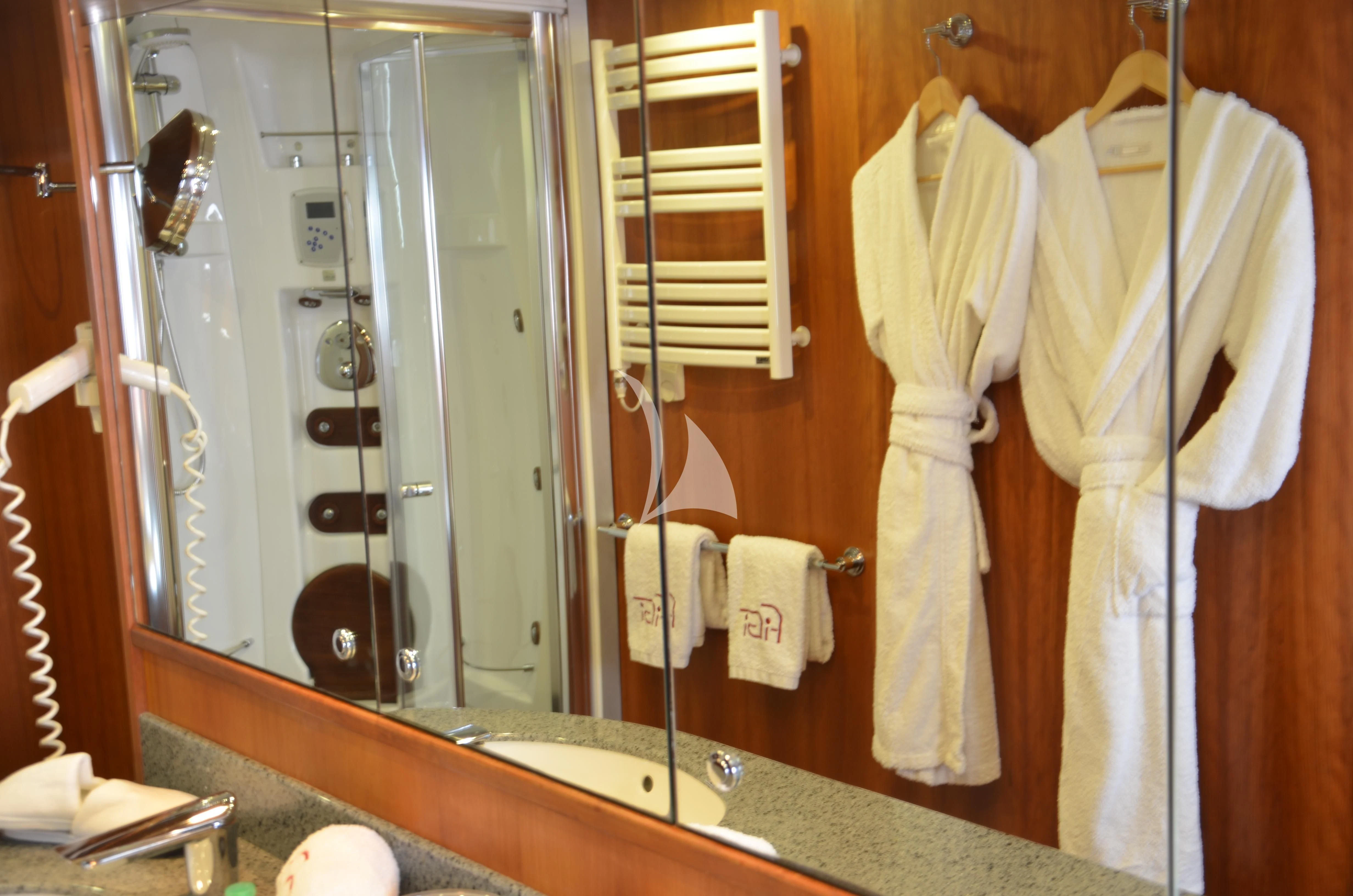 a bathroom with a large mirror aboard FIGI Yacht for Sale