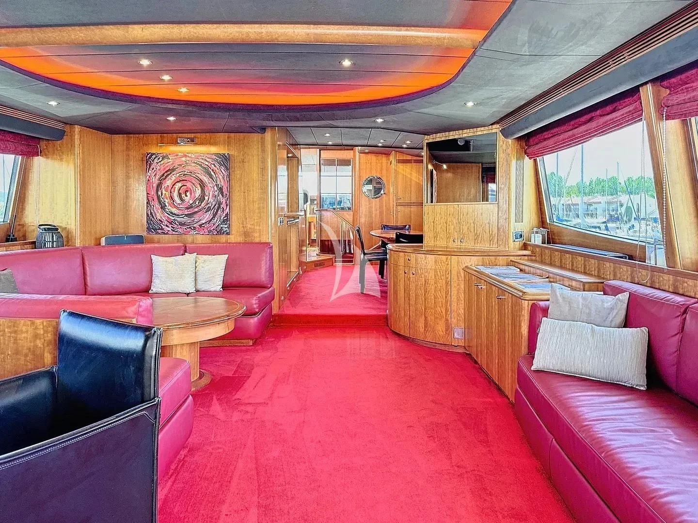 a train car with pink seats aboard FIGI Yacht for Sale