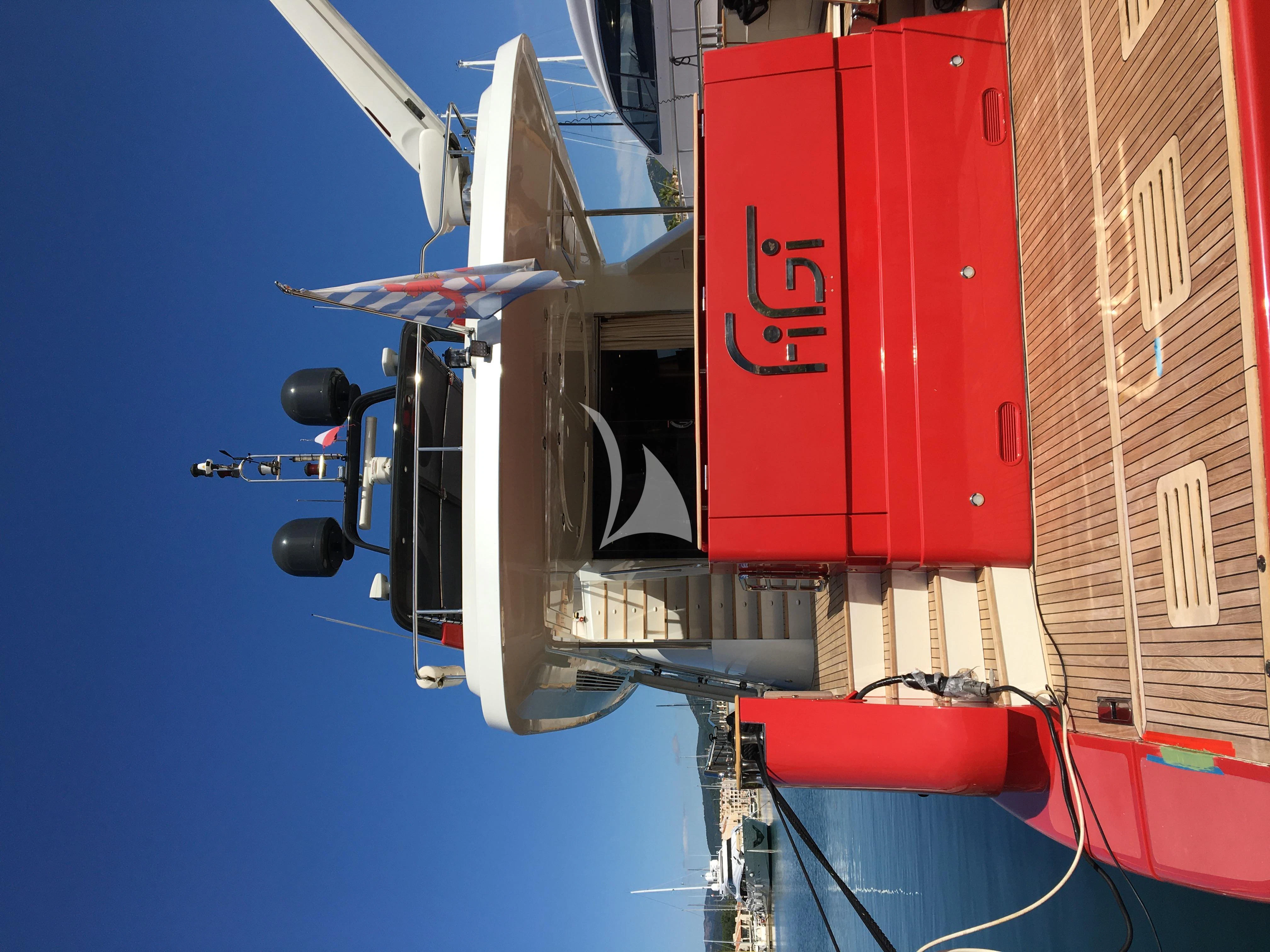 a large white and red container ship aboard FIGI Yacht for Sale