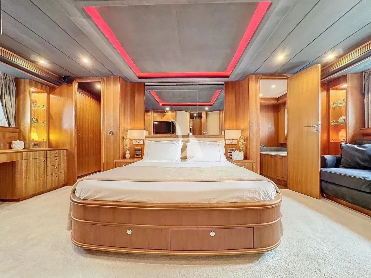 a large bed in a room aboard FIGI Yacht for Sale