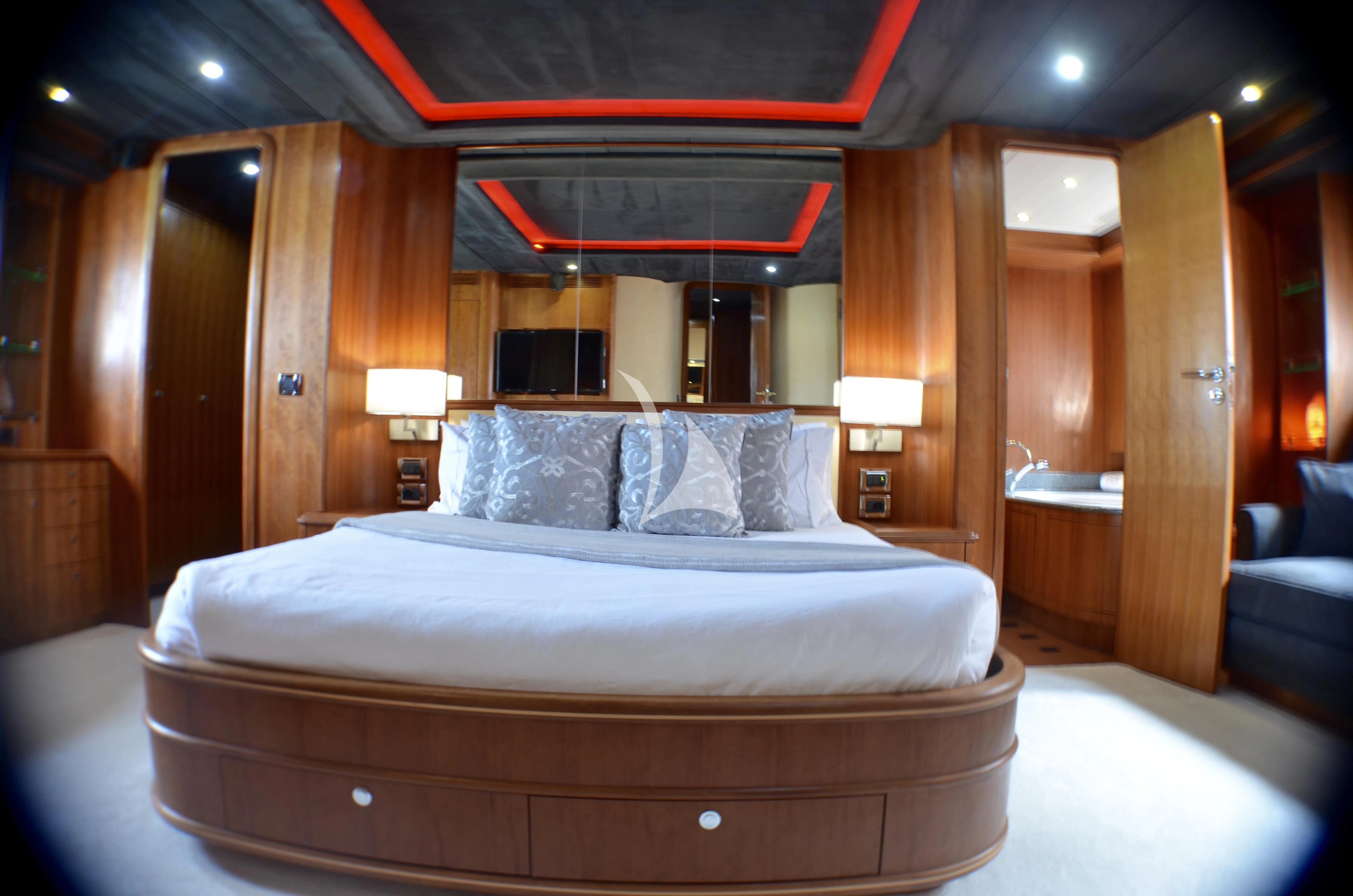 a bed in a room aboard FIGI Yacht for Sale