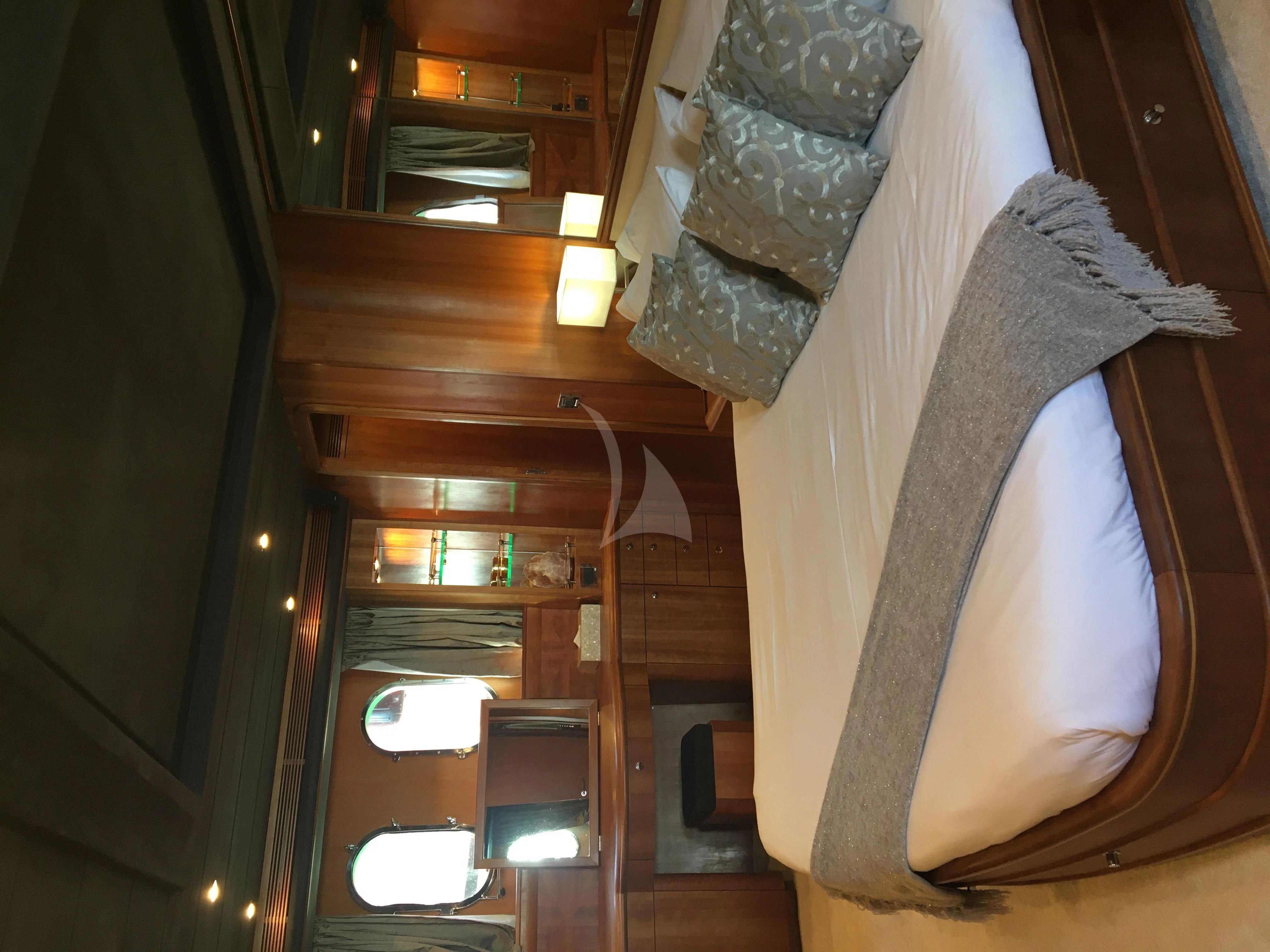 a room with a towel and a bed aboard FIGI Yacht for Sale