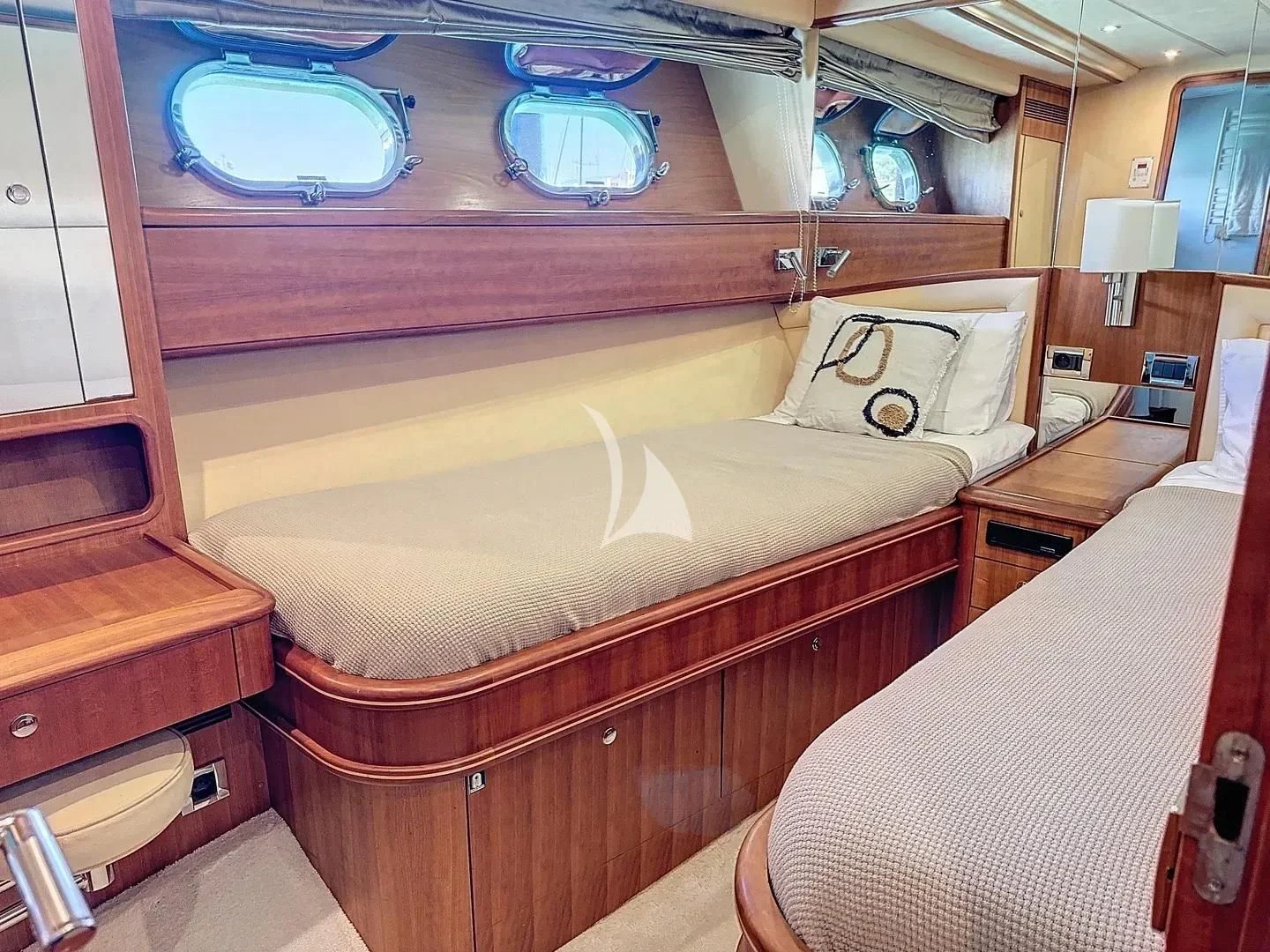 a room with a bed and a window aboard FIGI Yacht for Sale