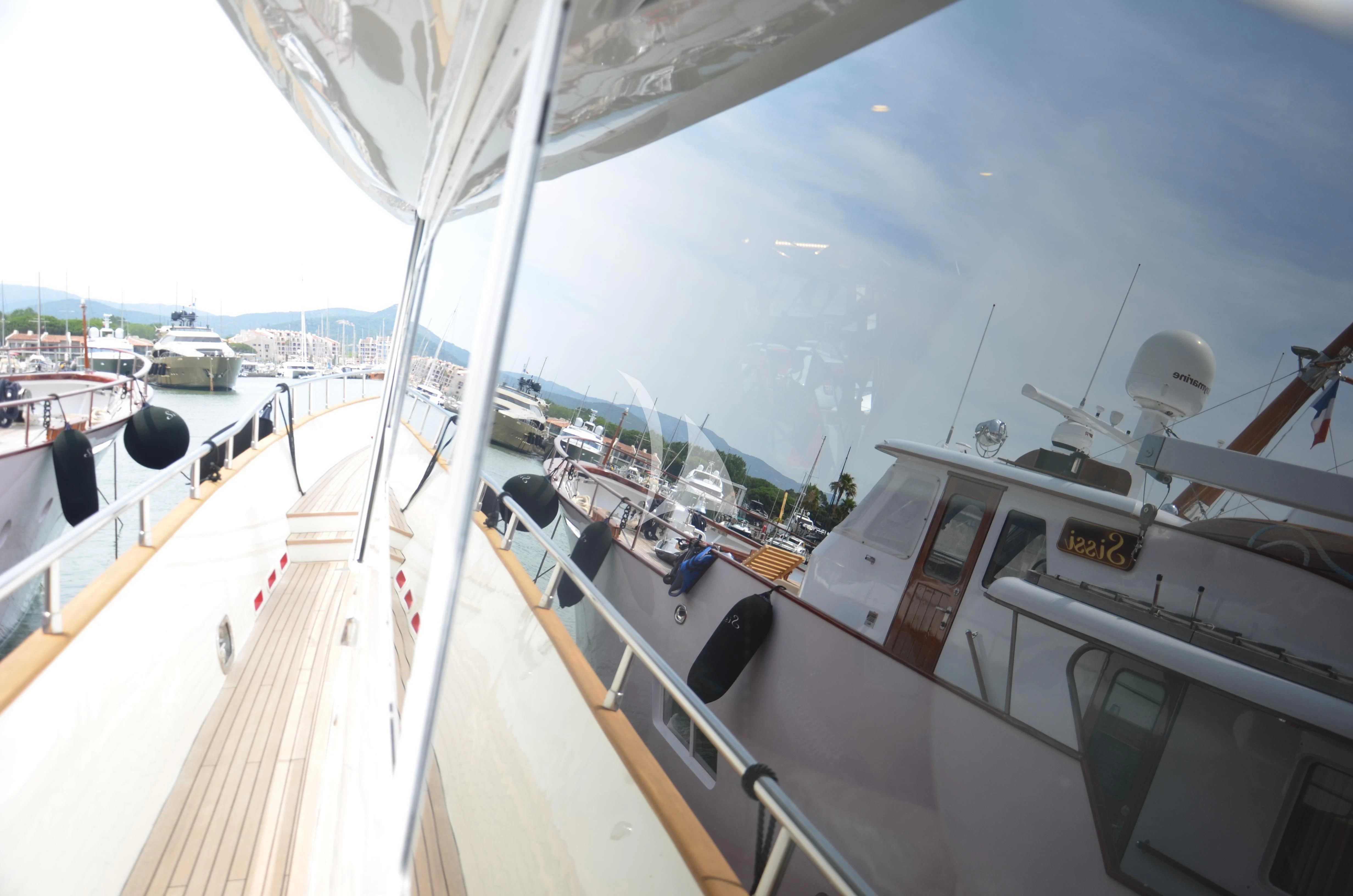 a large ship in a harbor aboard FIGI Yacht for Sale