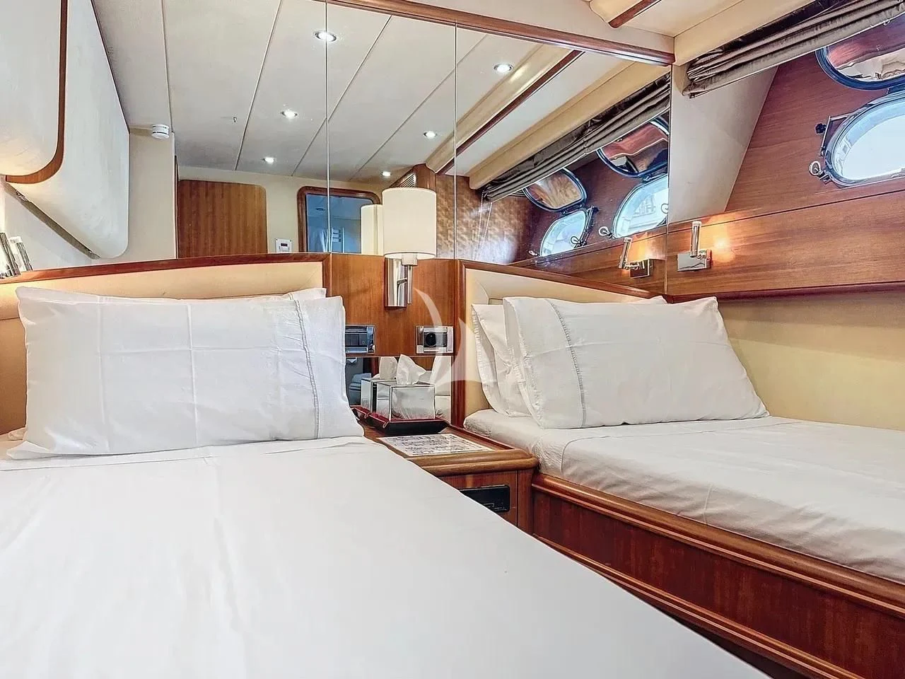 a couple of beds in a room aboard FIGI Yacht for Sale