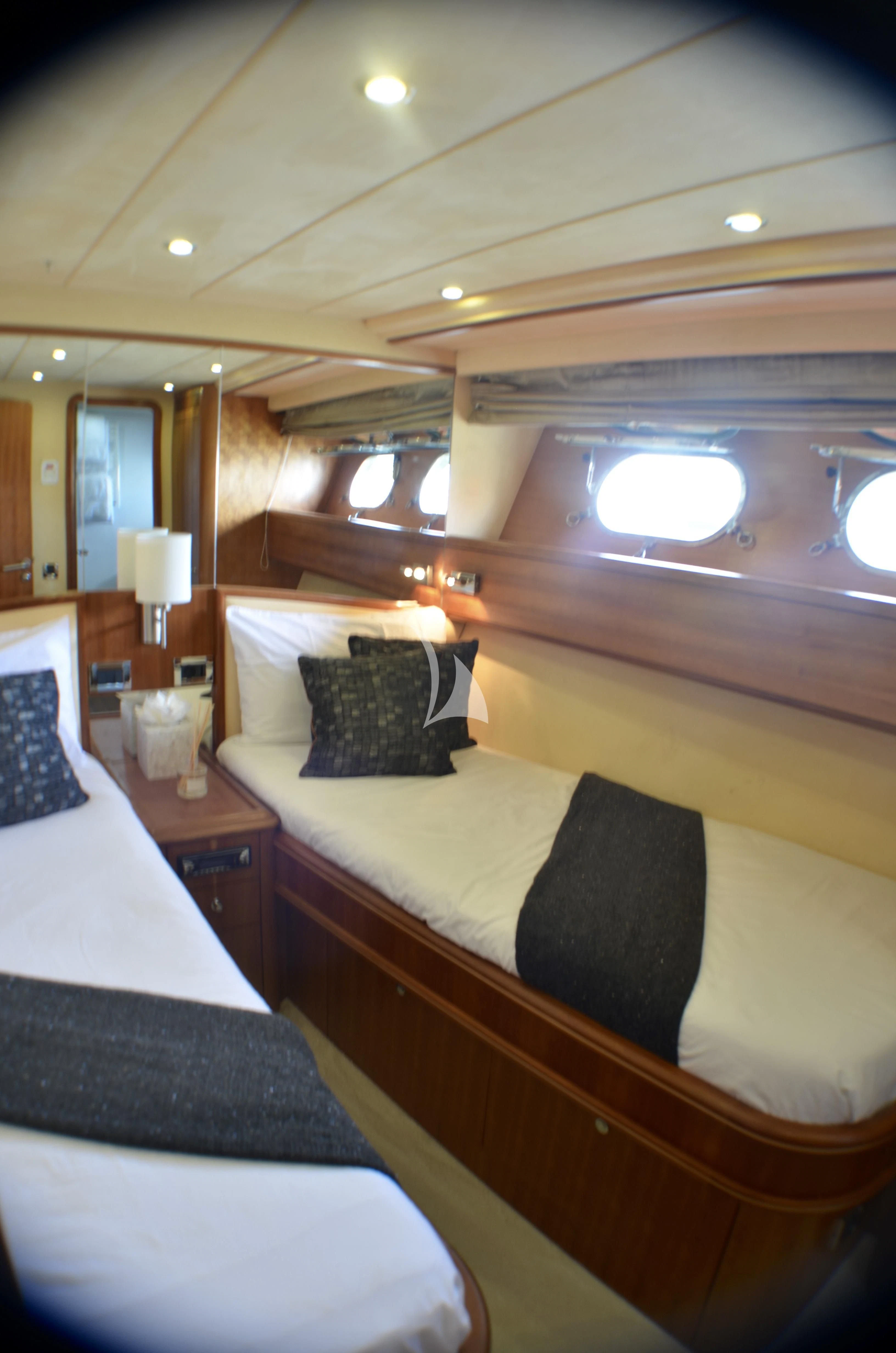 a room with two beds aboard FIGI Yacht for Sale