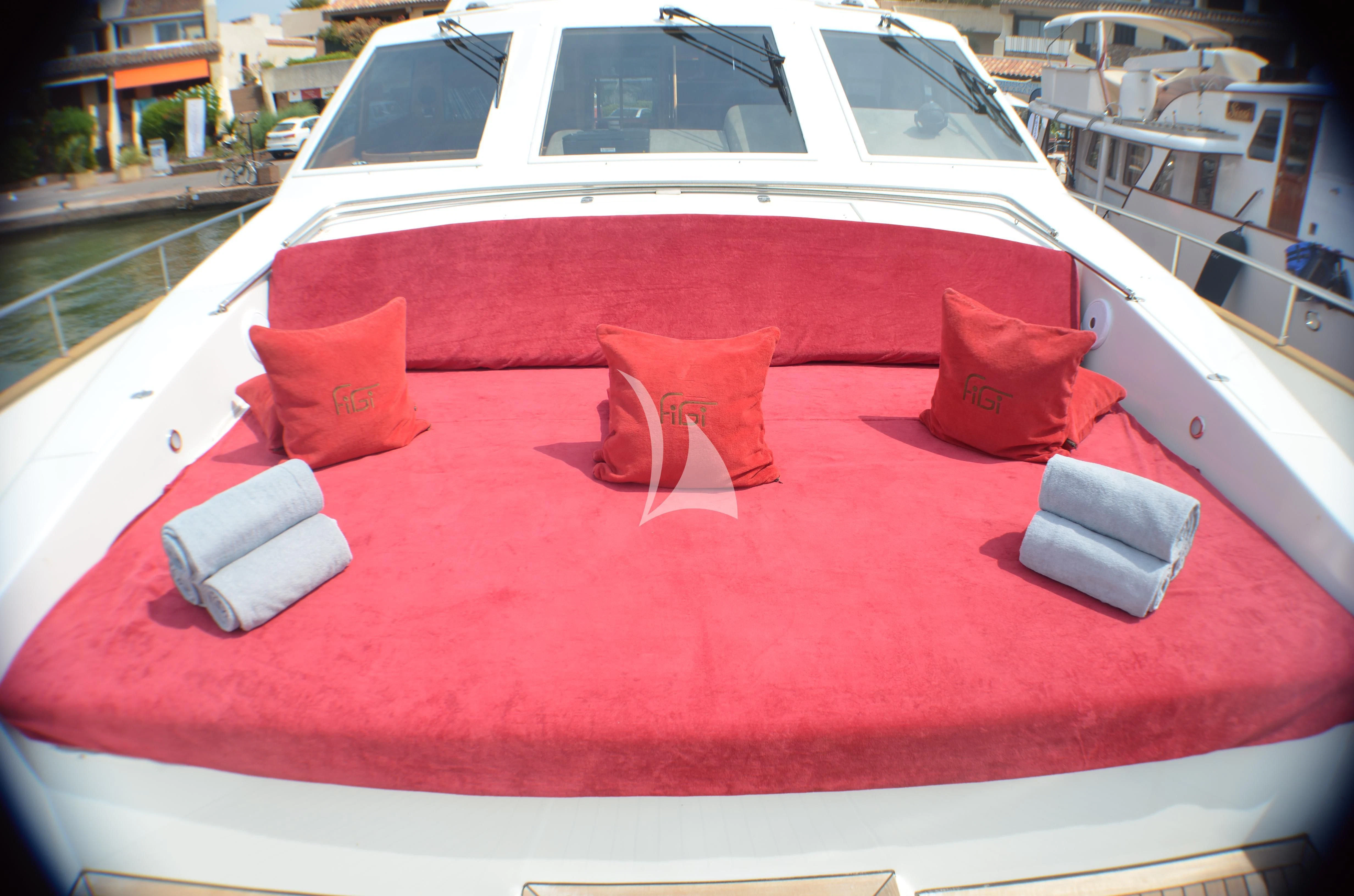 a red car with a white convertible aboard FIGI Yacht for Sale