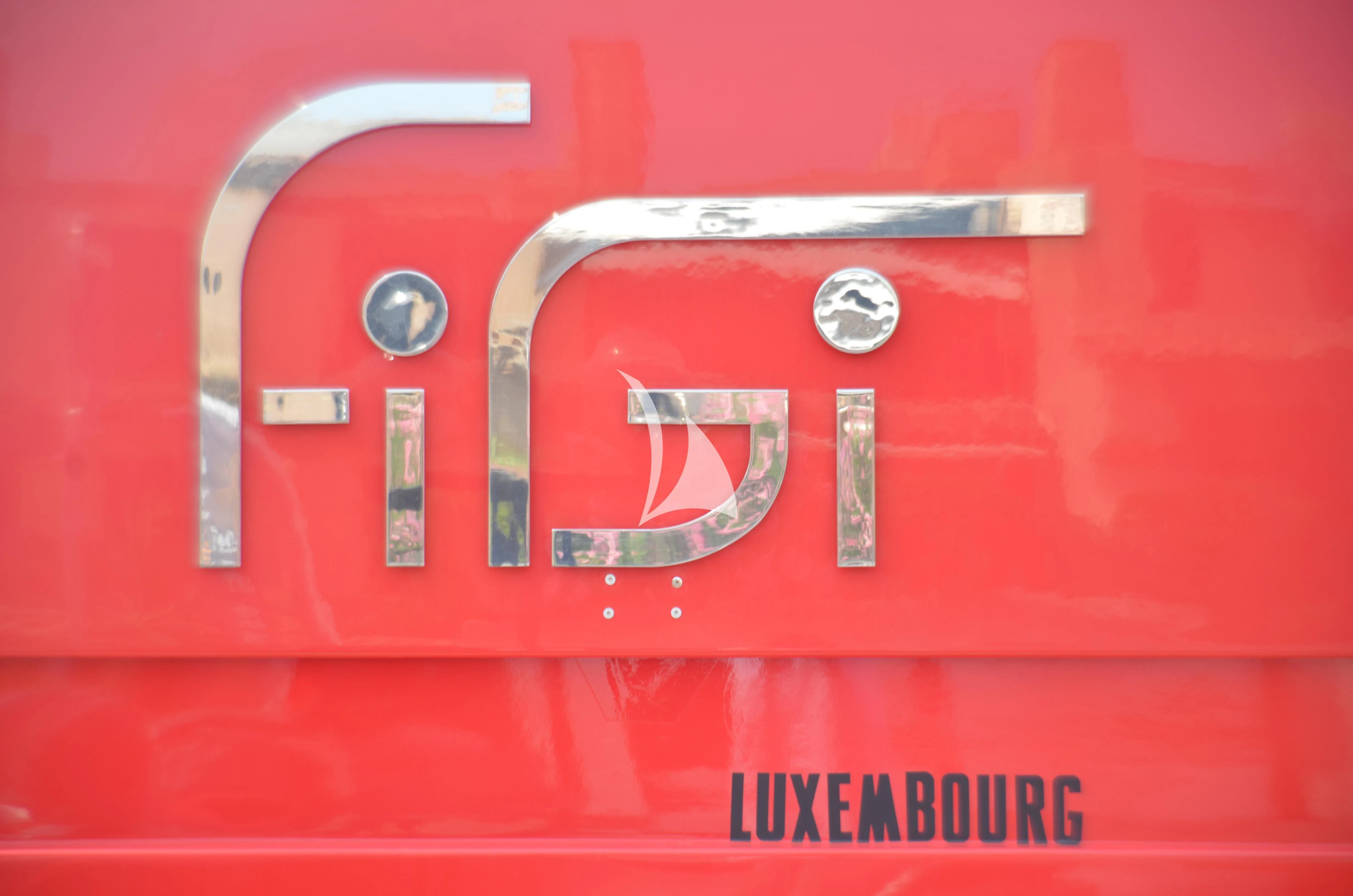 a red and silver gun aboard FIGI Yacht for Sale