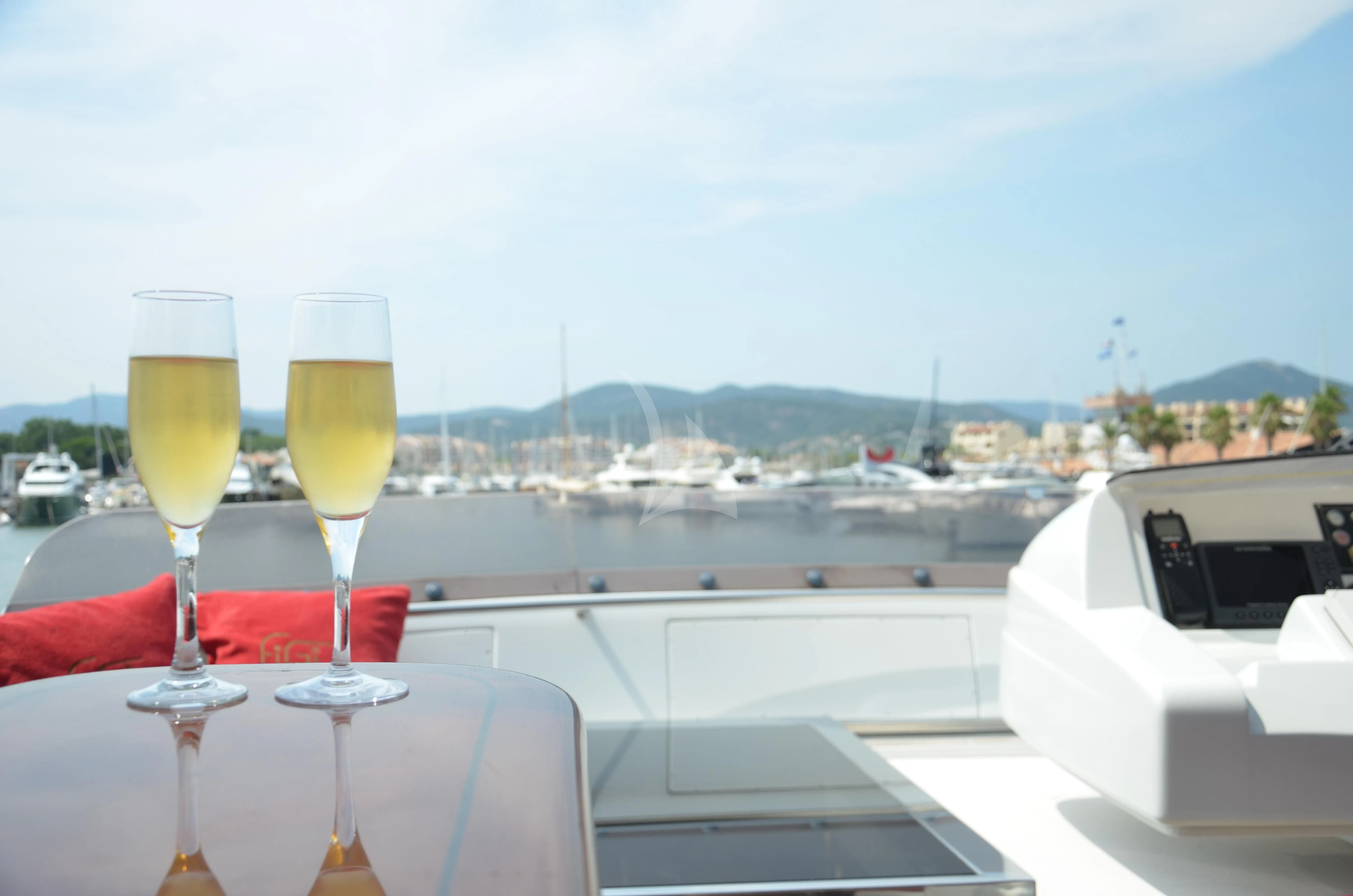 a couple of glasses of champagne on a boat aboard FIGI Yacht for Sale