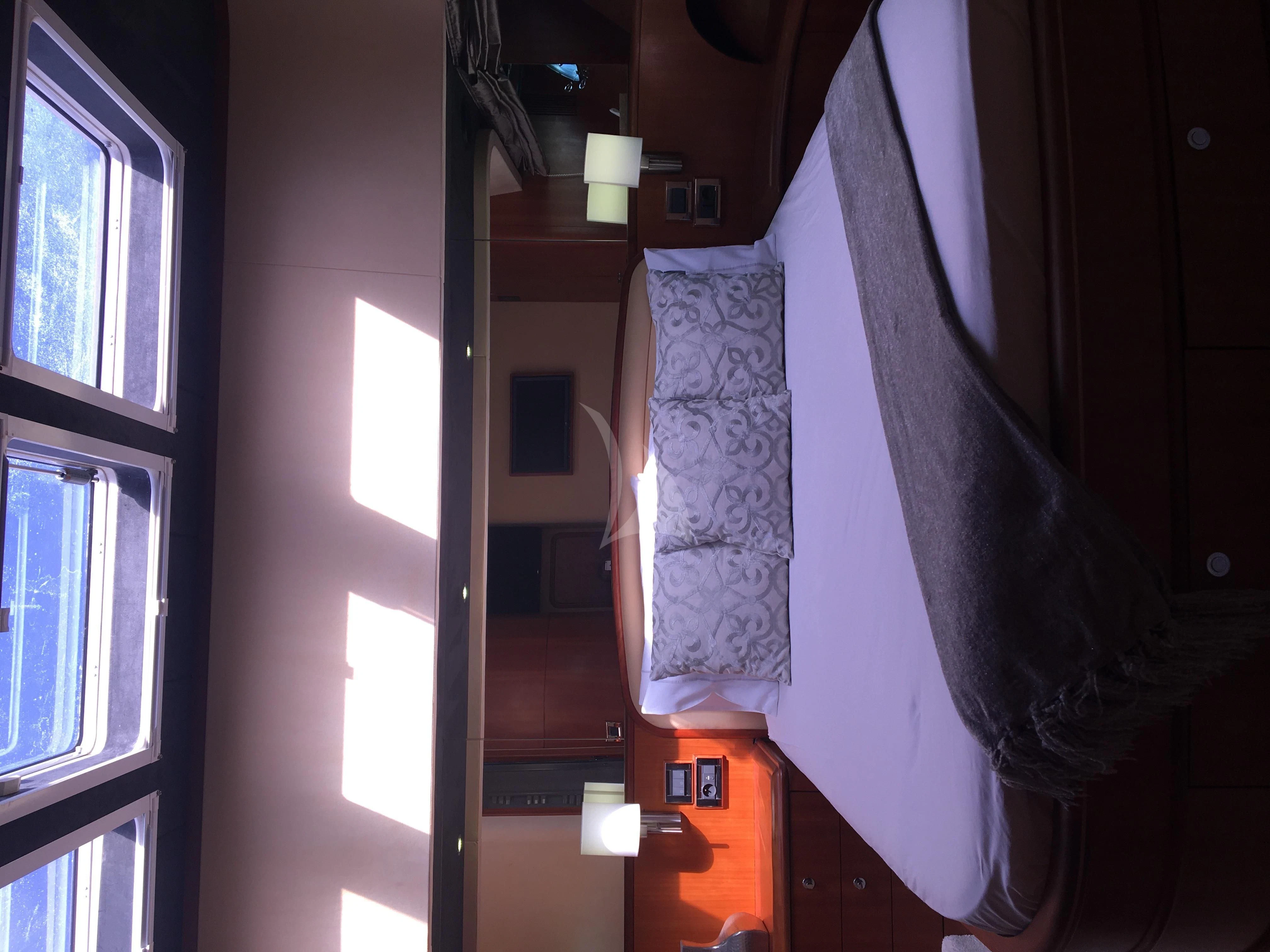 a suit on a wall aboard FIGI Yacht for Sale