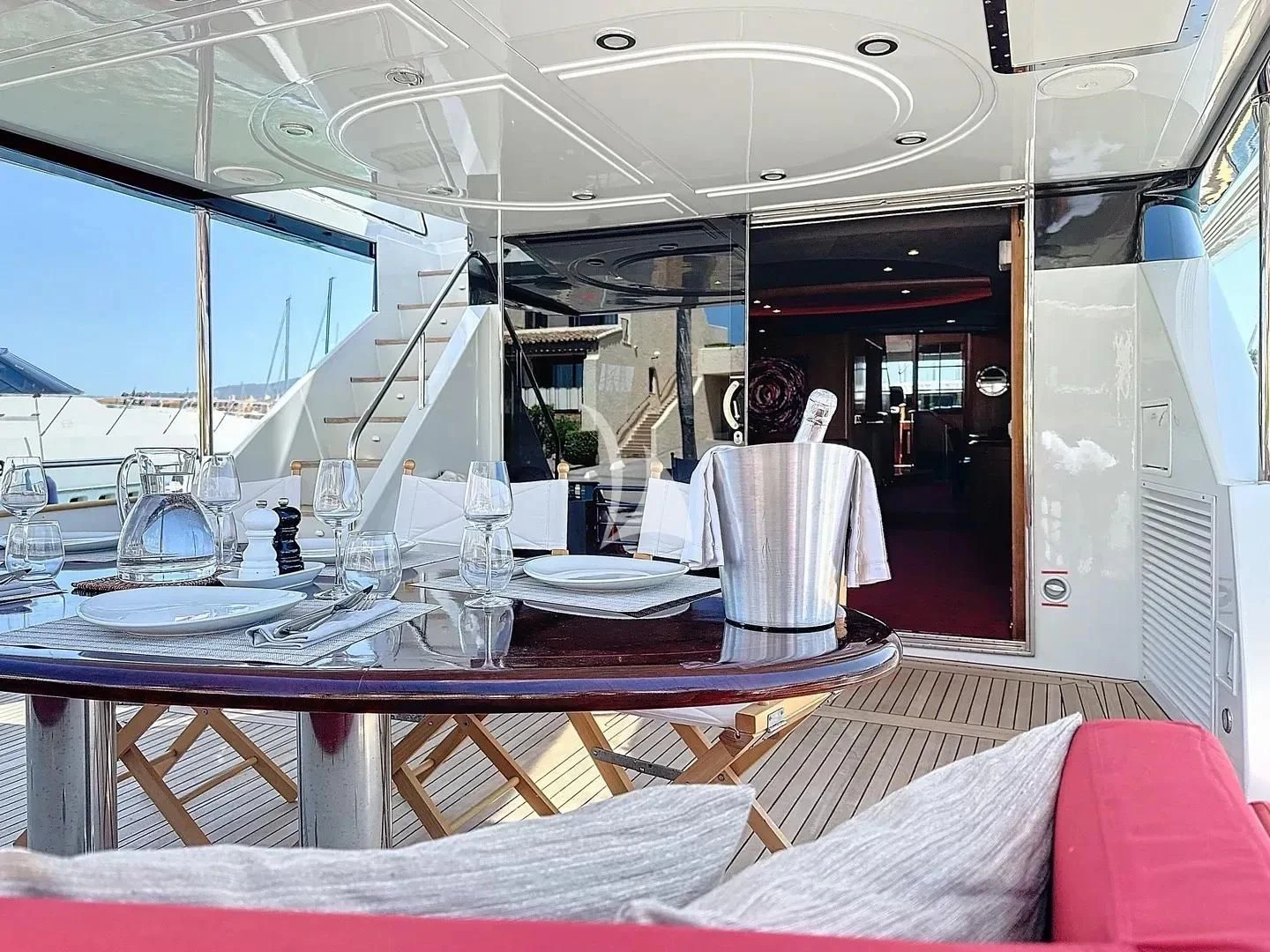 a table with plates and glasses aboard FIGI Yacht for Sale