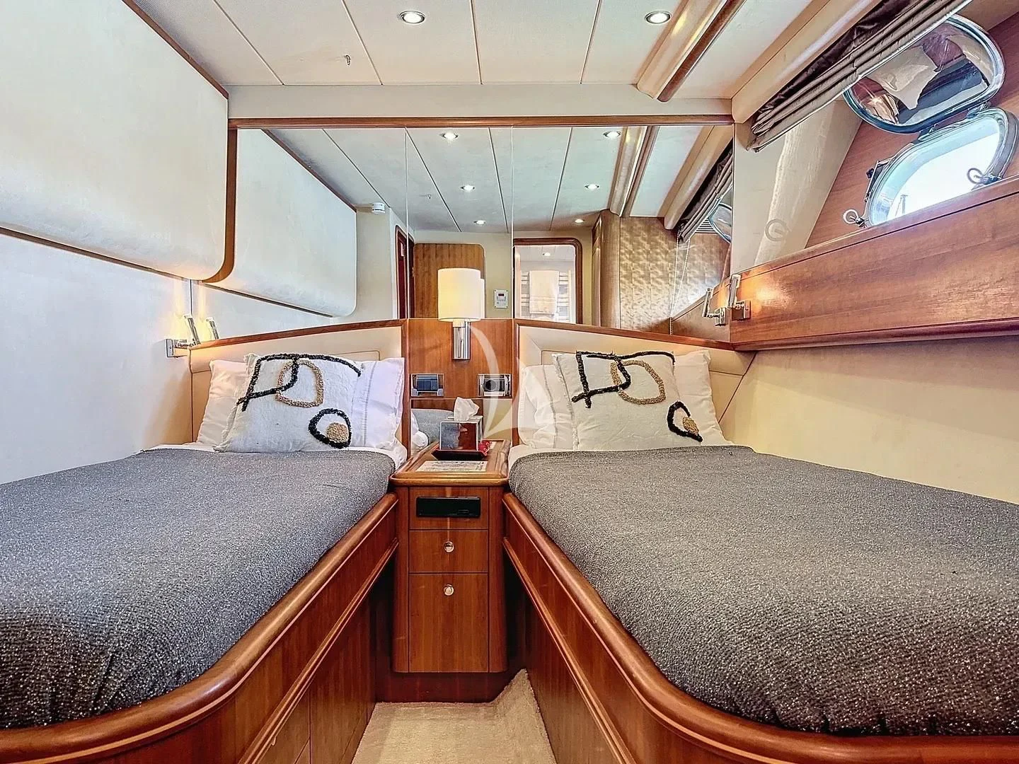 a room with two beds aboard FIGI Yacht for Sale