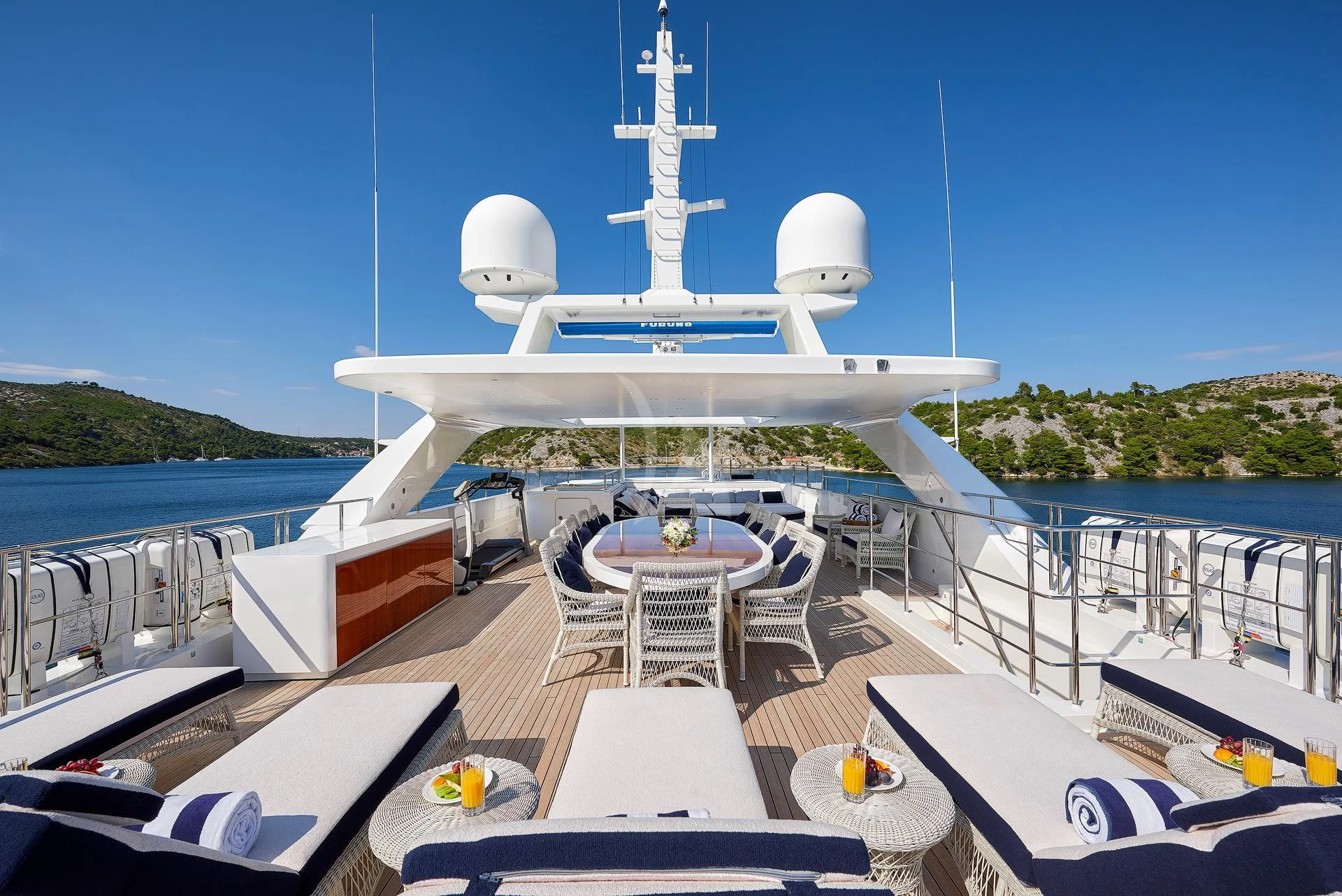 a large white ship docked at a pier aboard REVE D'OR Yacht for Sale