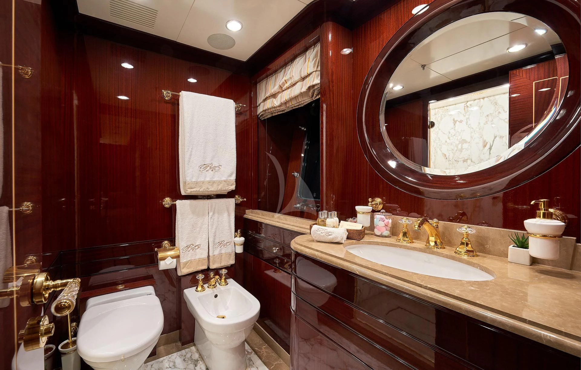 a bathroom with a large mirror aboard REVE D'OR Yacht for Sale