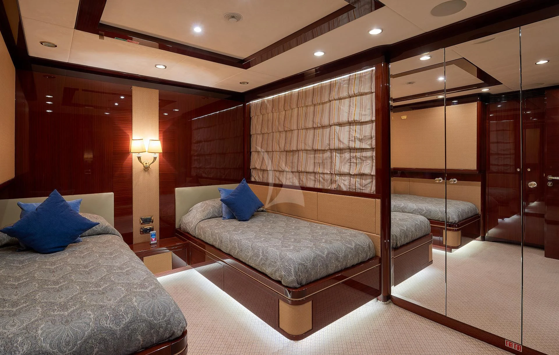 a room with a bed and a couch aboard REVE D'OR Yacht for Sale