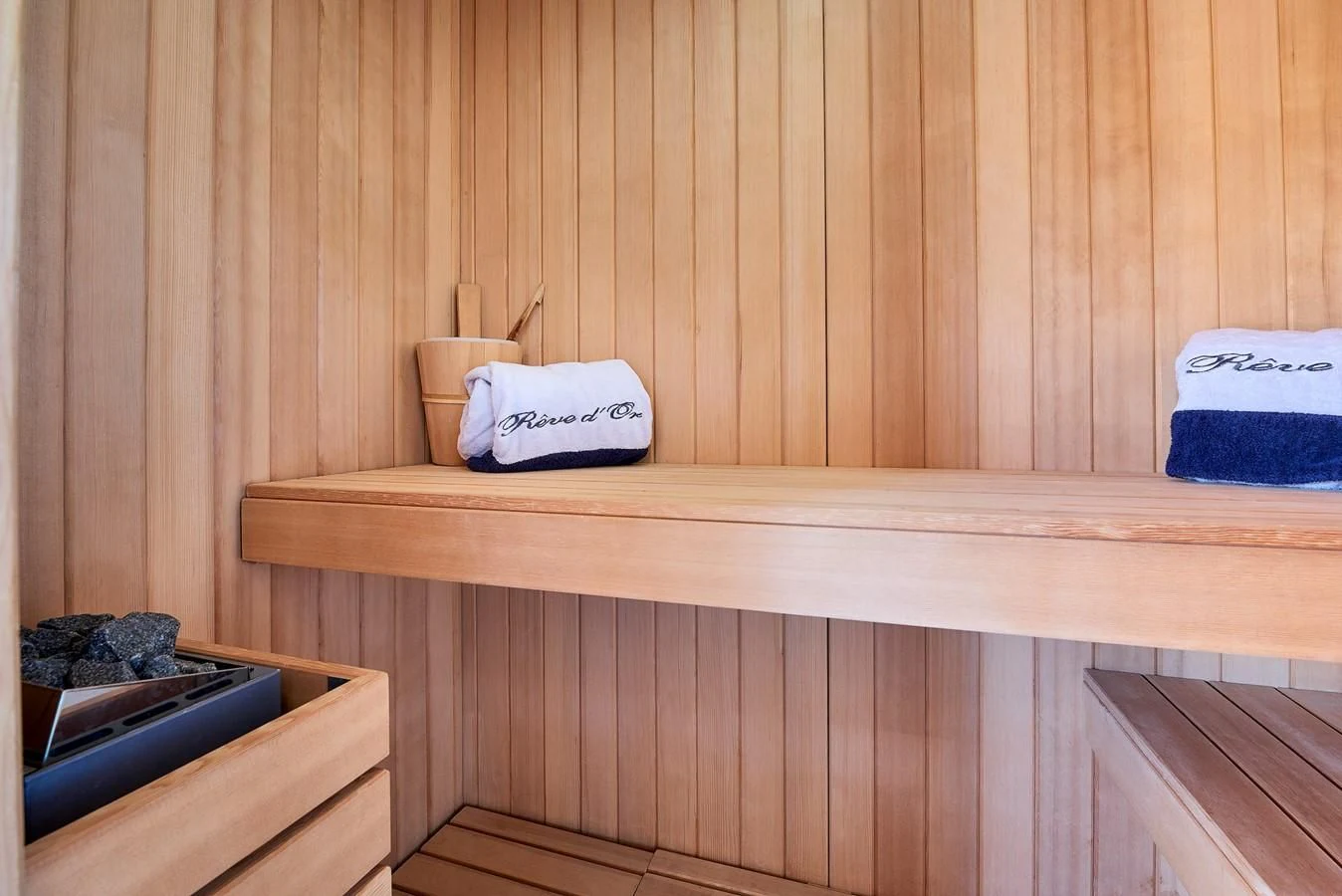 a wooden shelf with a cup and a box on it aboard REVE D'OR Yacht for Sale