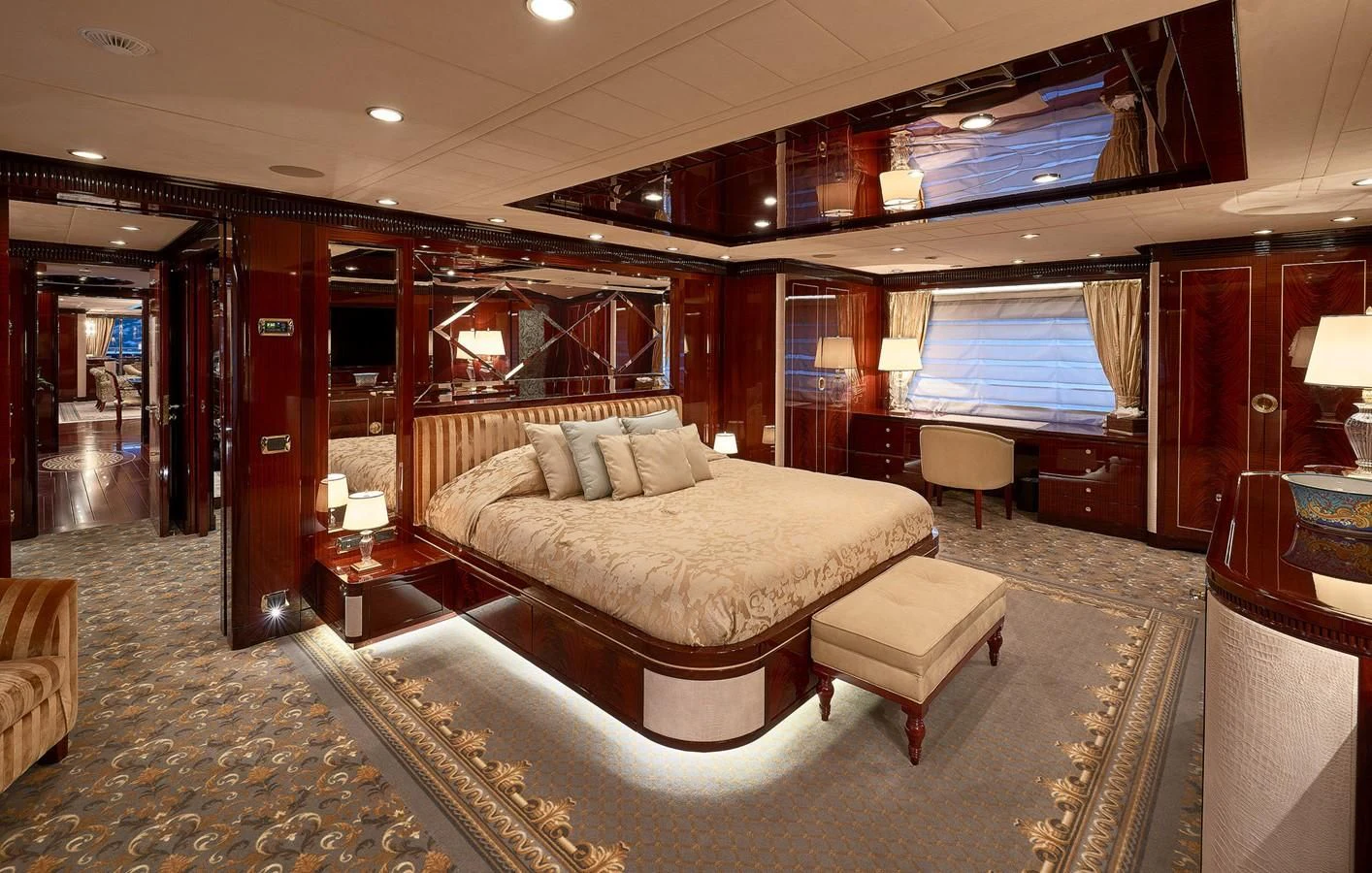 a room with a bed and a couch aboard REVE D'OR Yacht for Sale