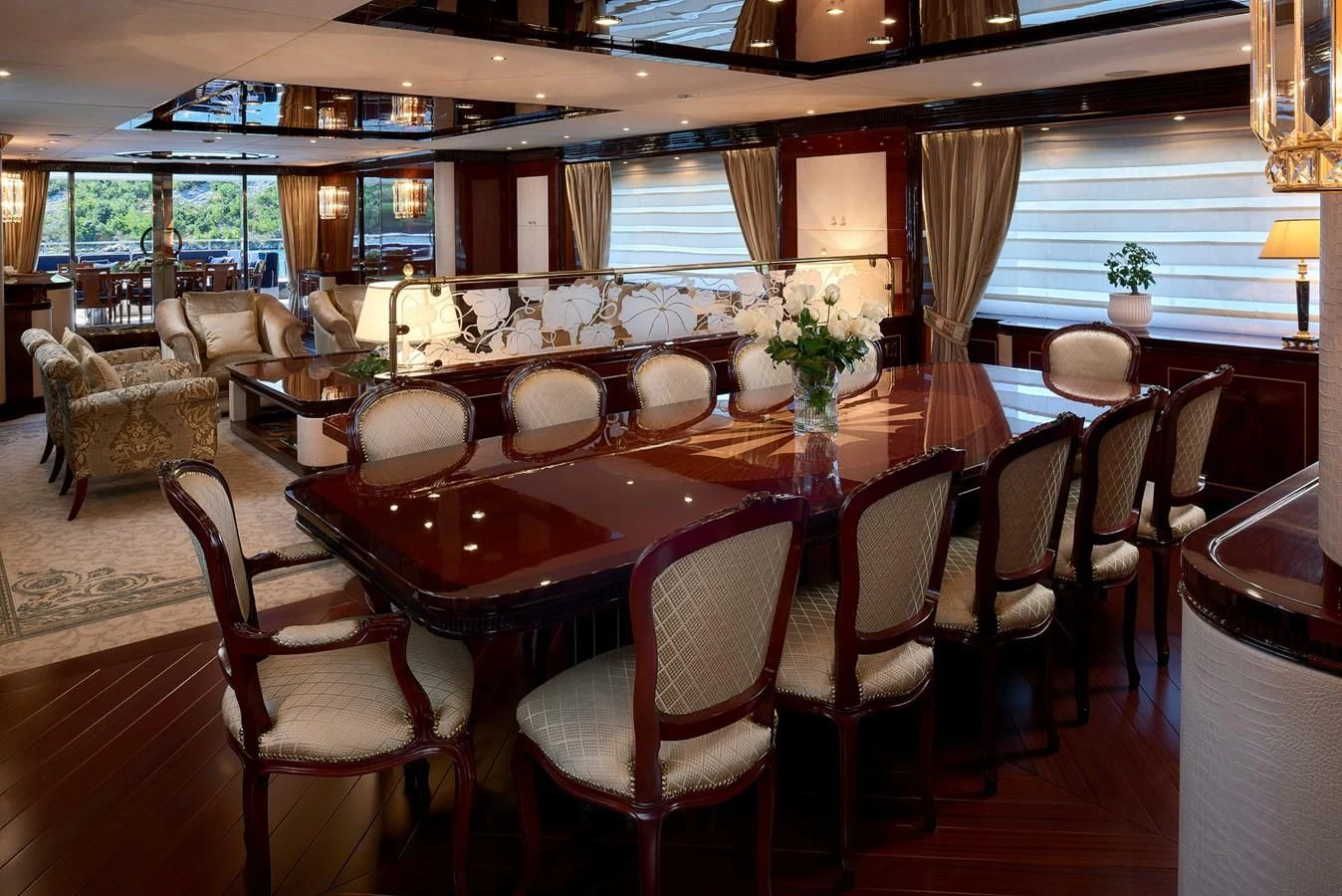 a dining room with a table and chairs aboard REVE D'OR Yacht for Sale