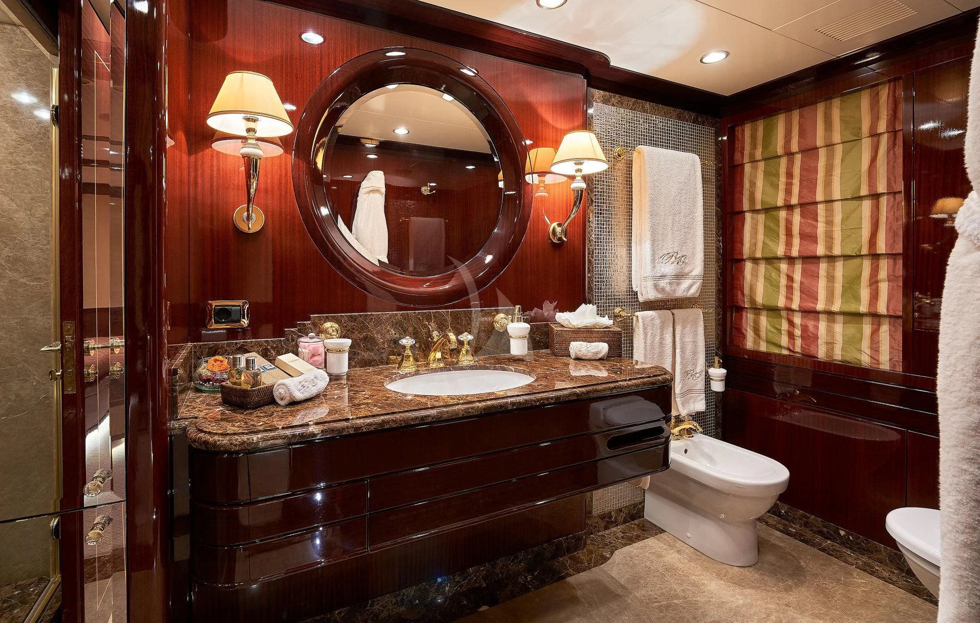 a bathroom with a large mirror aboard REVE D'OR Yacht for Sale