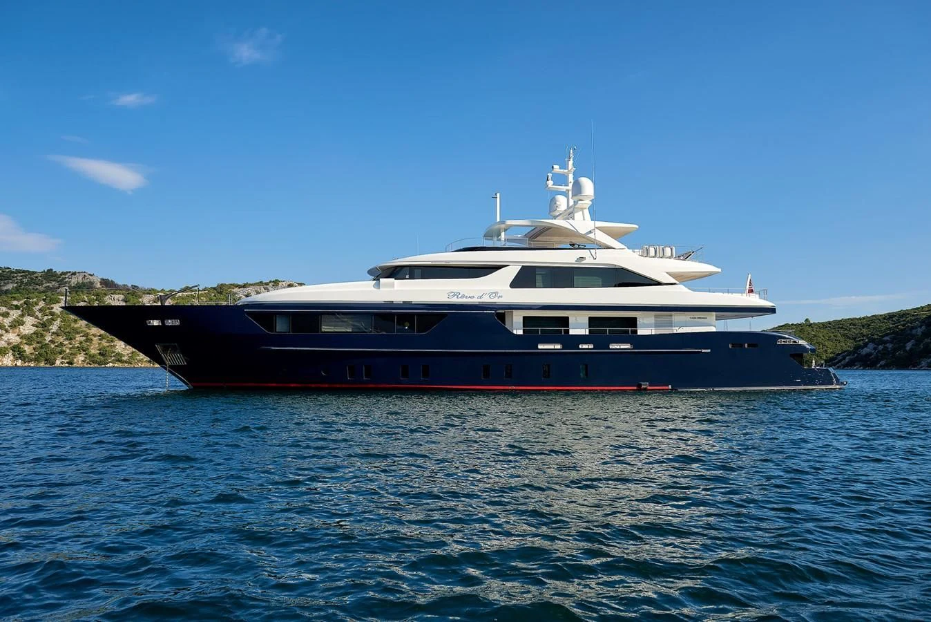 a large boat in the water aboard REVE D'OR Yacht for Sale