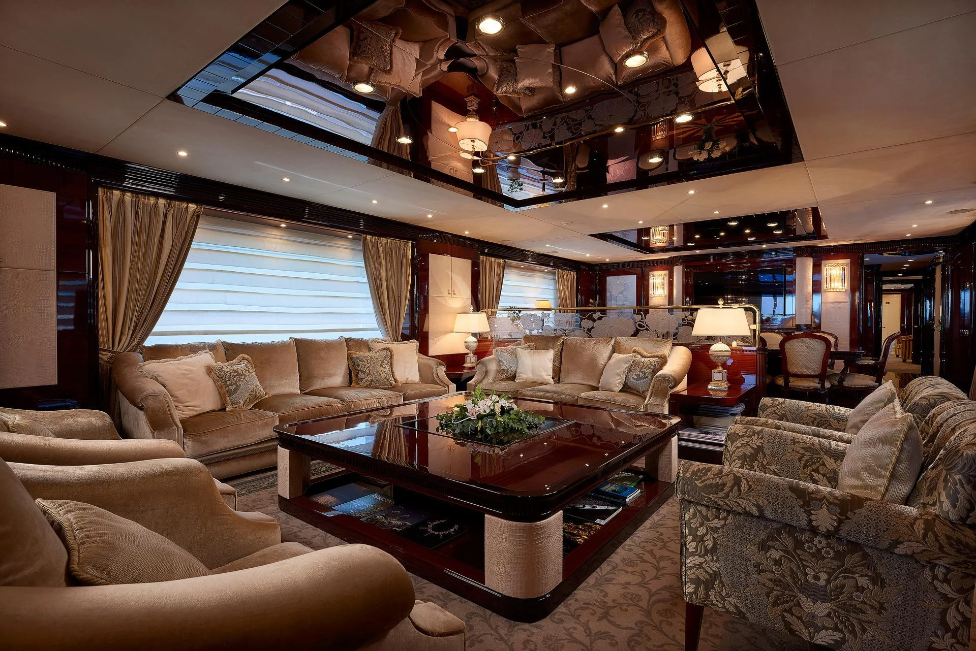a living room with a large chandelier aboard REVE D'OR Yacht for Sale