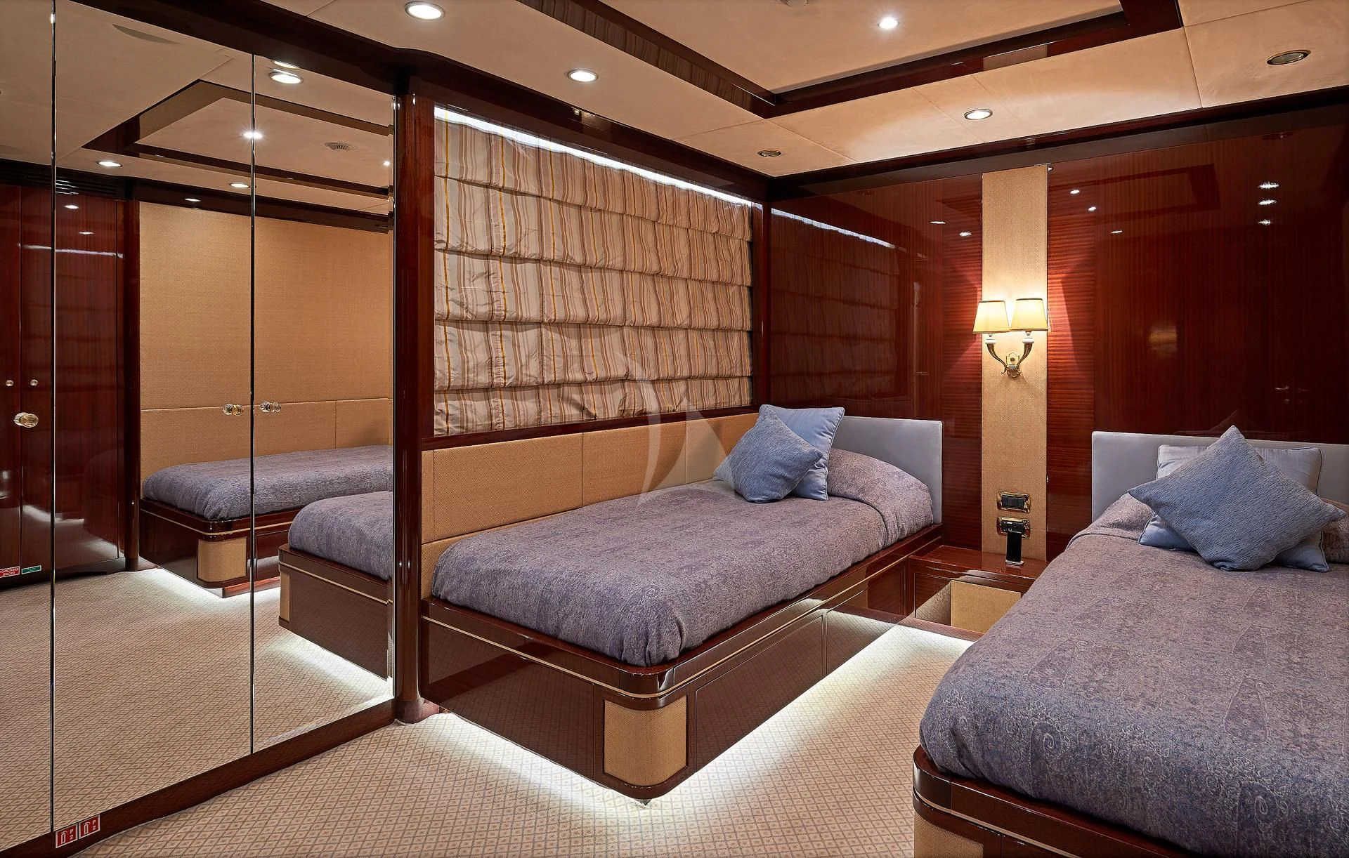 a room with a bed and a mirror aboard REVE D'OR Yacht for Sale