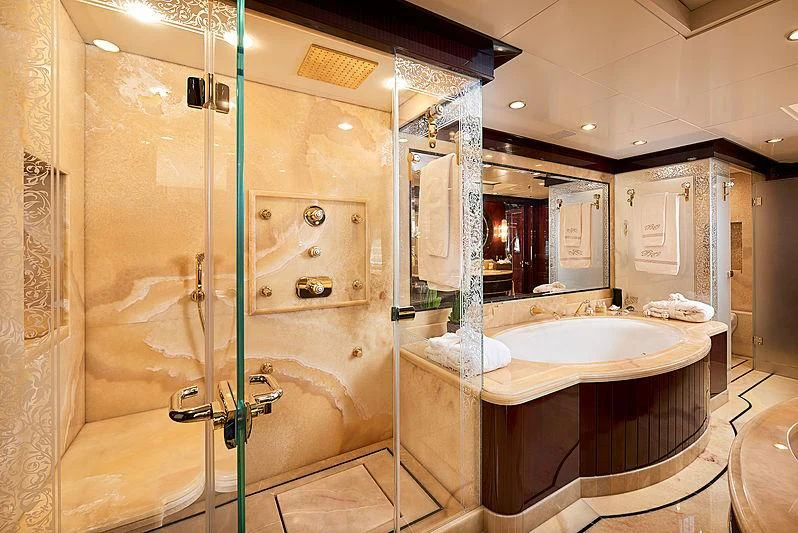 a bathroom with a glass shower aboard REVE D'OR Yacht for Sale