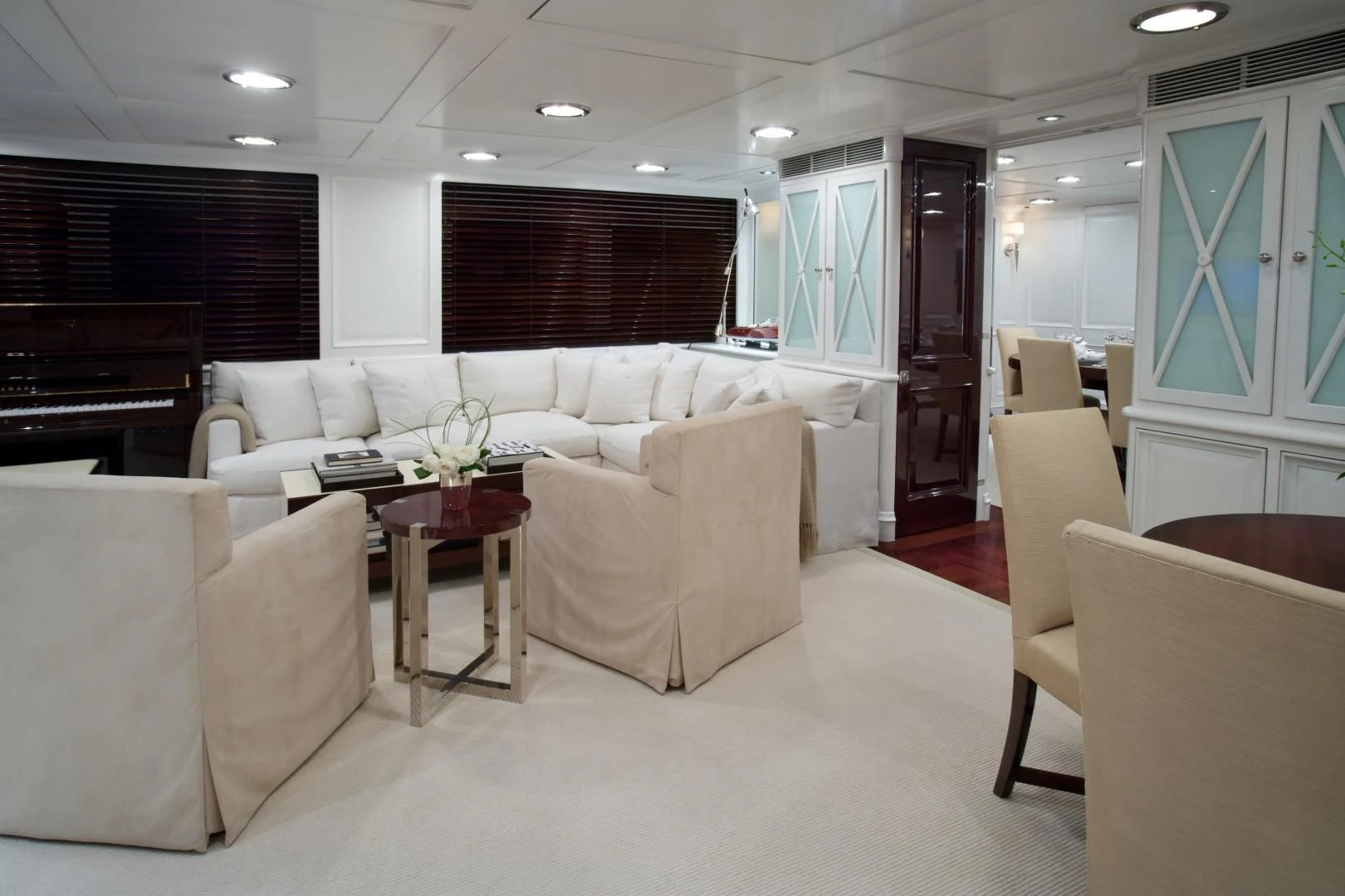 a living room with a couch and a television aboard EXPLORA Yacht for Sale