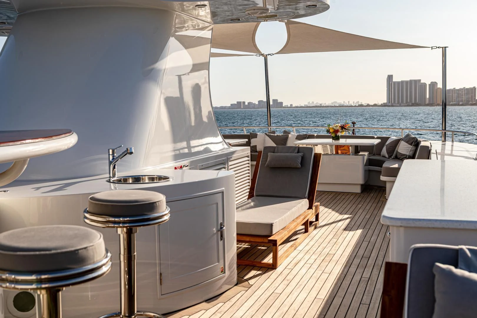 a room with a table and chairs aboard EXPLORA Yacht for Sale