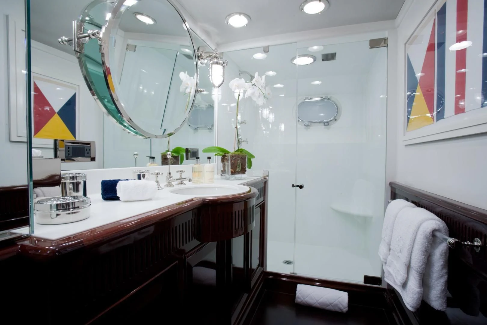 a bathroom with a sink and mirror aboard EXPLORA Yacht for Sale